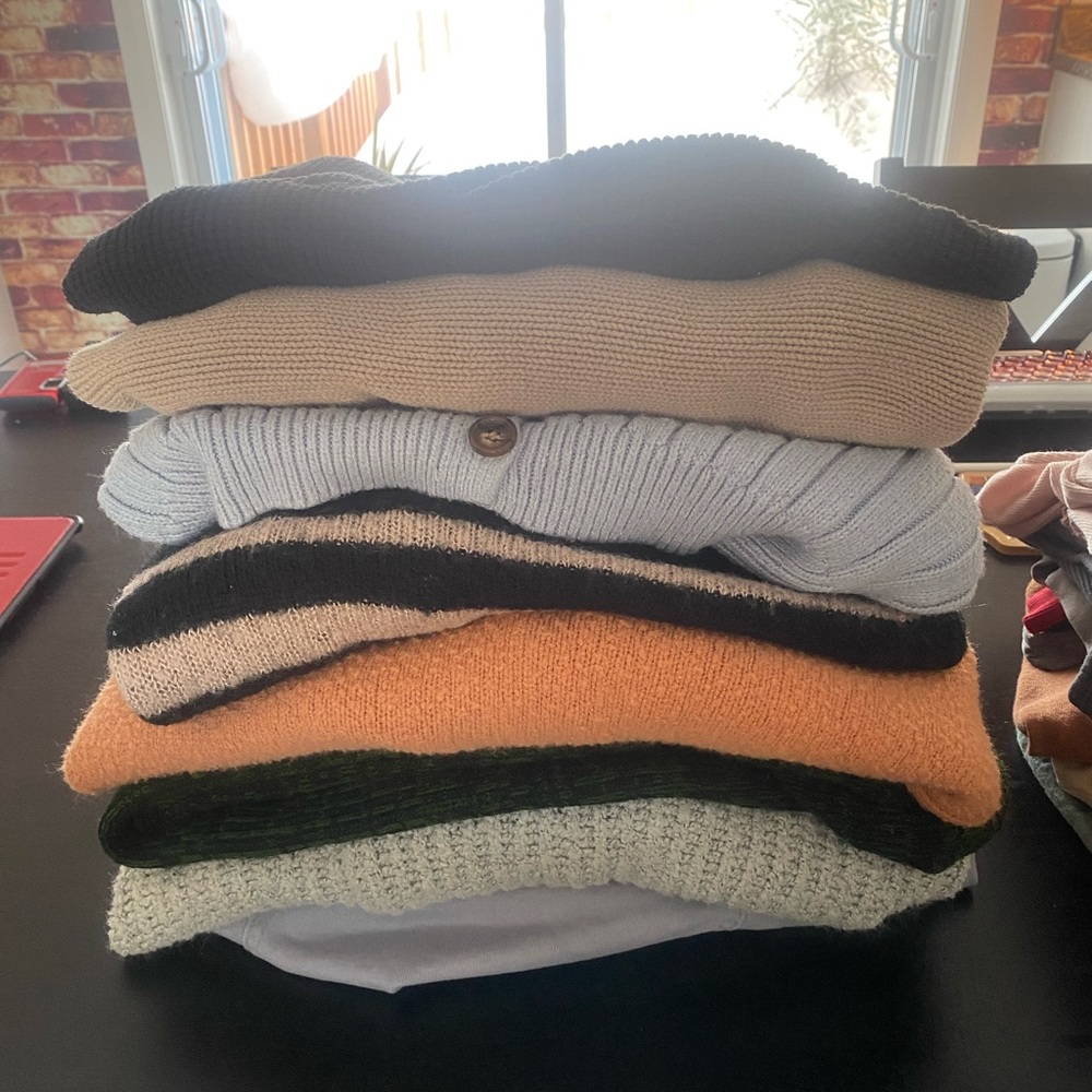 Stack of Cozy Sweaters and Cardigans in Various Colors